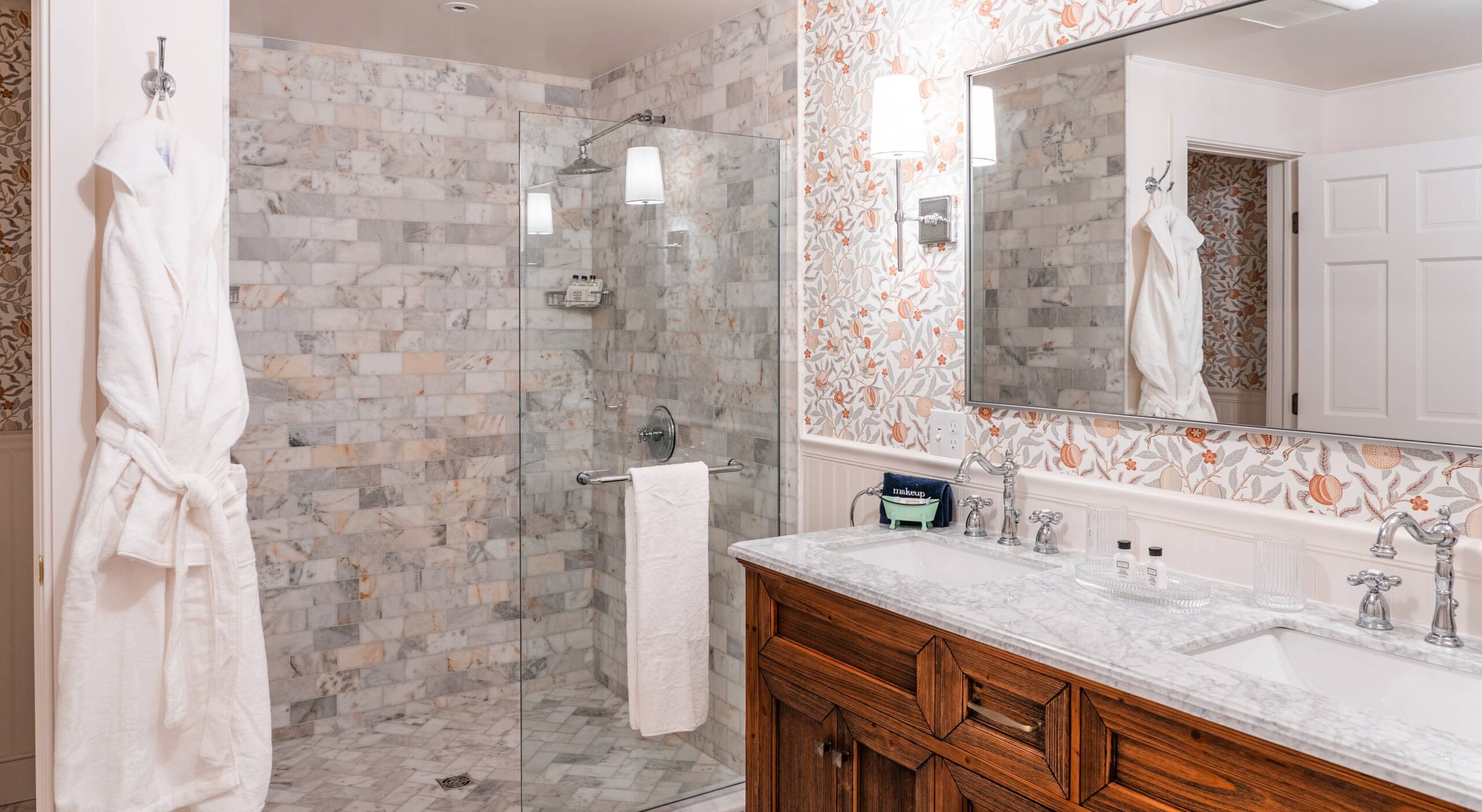 Modern bathroom with shower and marble features.