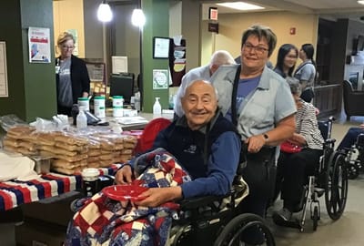Residents enjoying an activity in the common area.