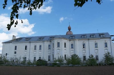 Exterior view of a large building with trees