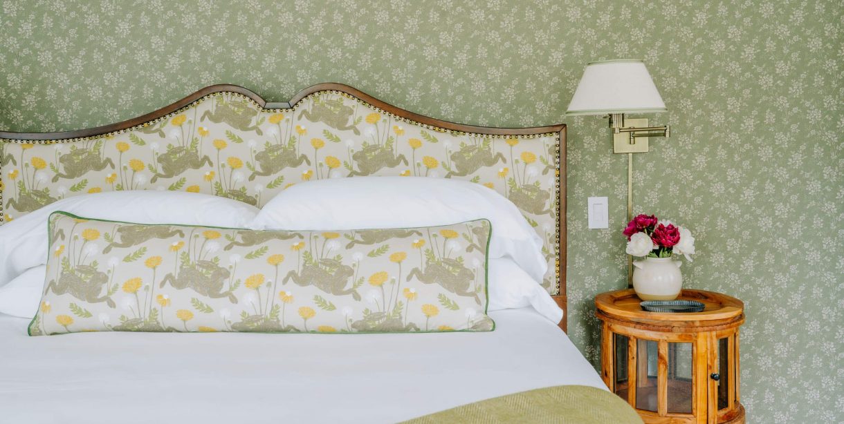 Cozy bedroom with floral decor and bedside table
