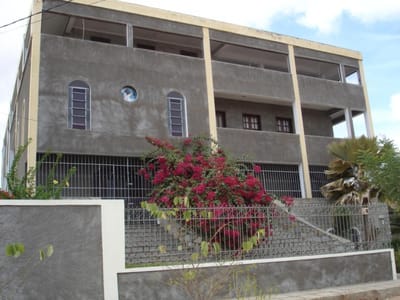 Exterior of a building with flowers in front