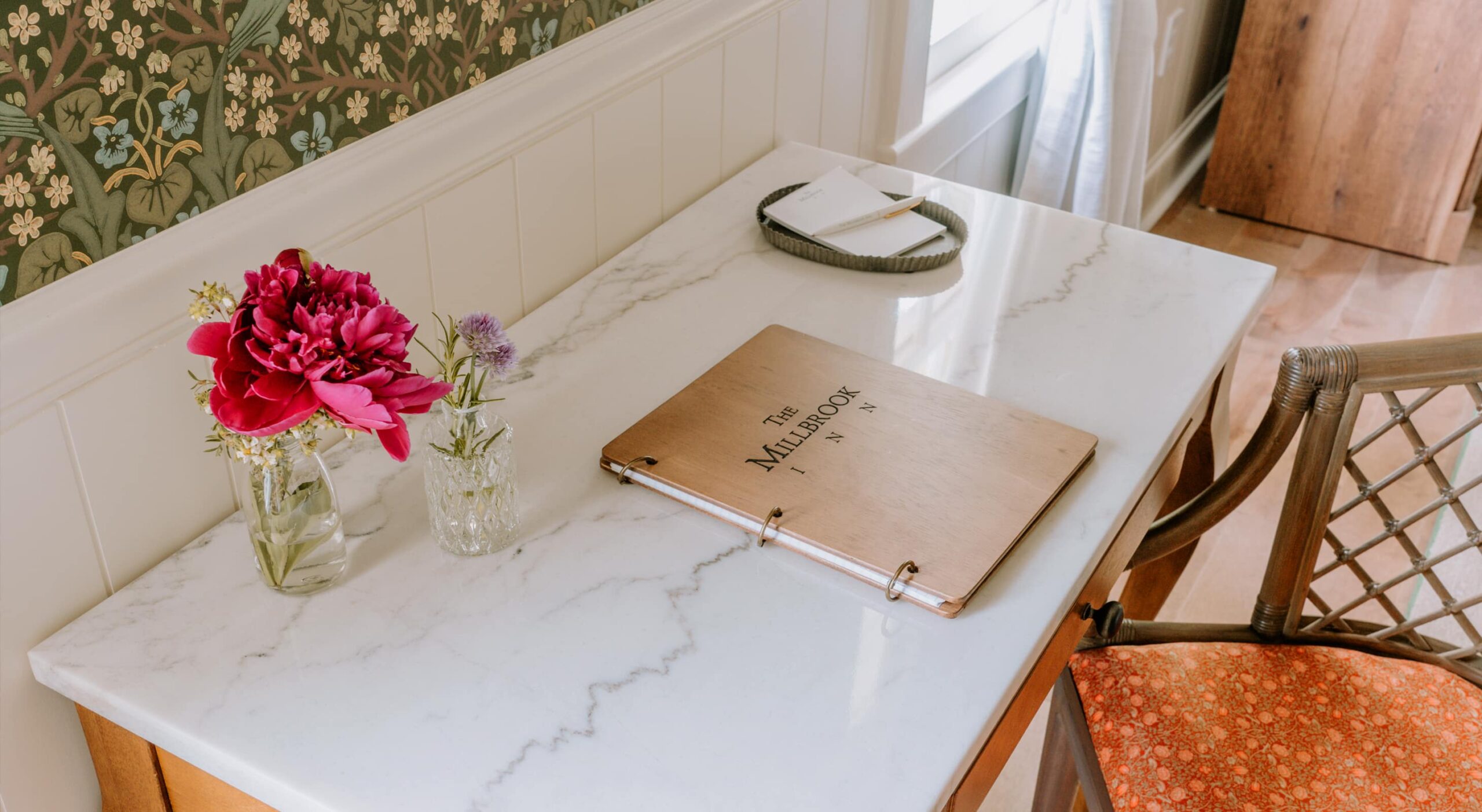 Decorative desk with flowers and a binder