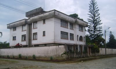 Exterior view of a large building with trees