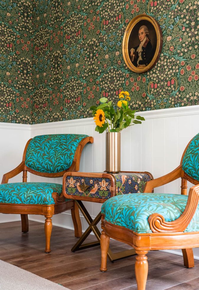 Stylish interior seating area with floral wallpaper
