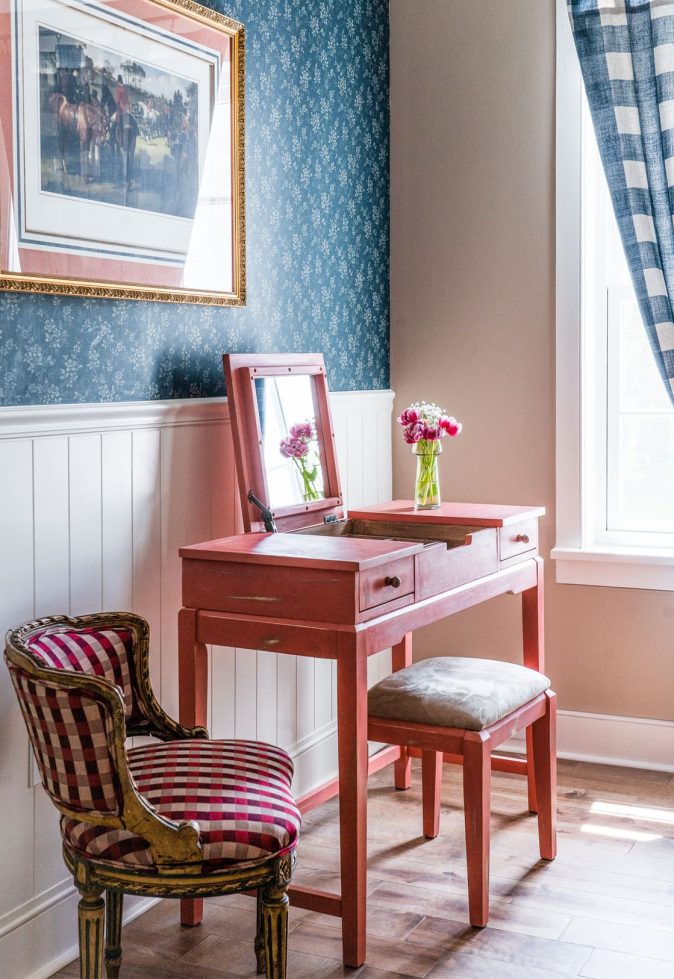 A cozy interior corner with a vanity table and chair.
