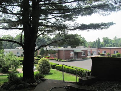 Exterior view of the facility with landscaping.