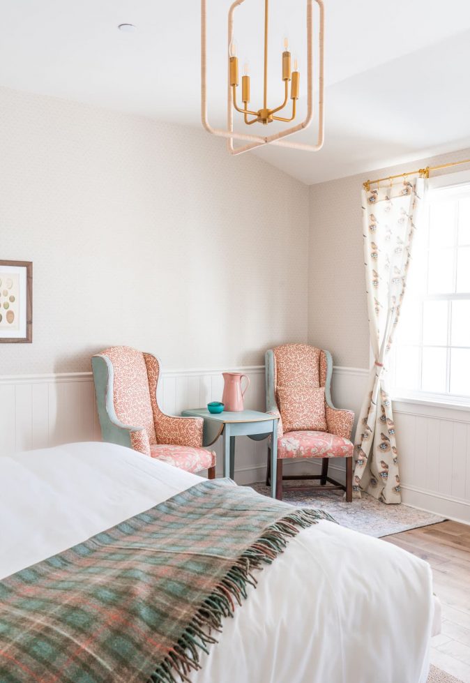 Bright, comfortable resident room with chairs and decor.