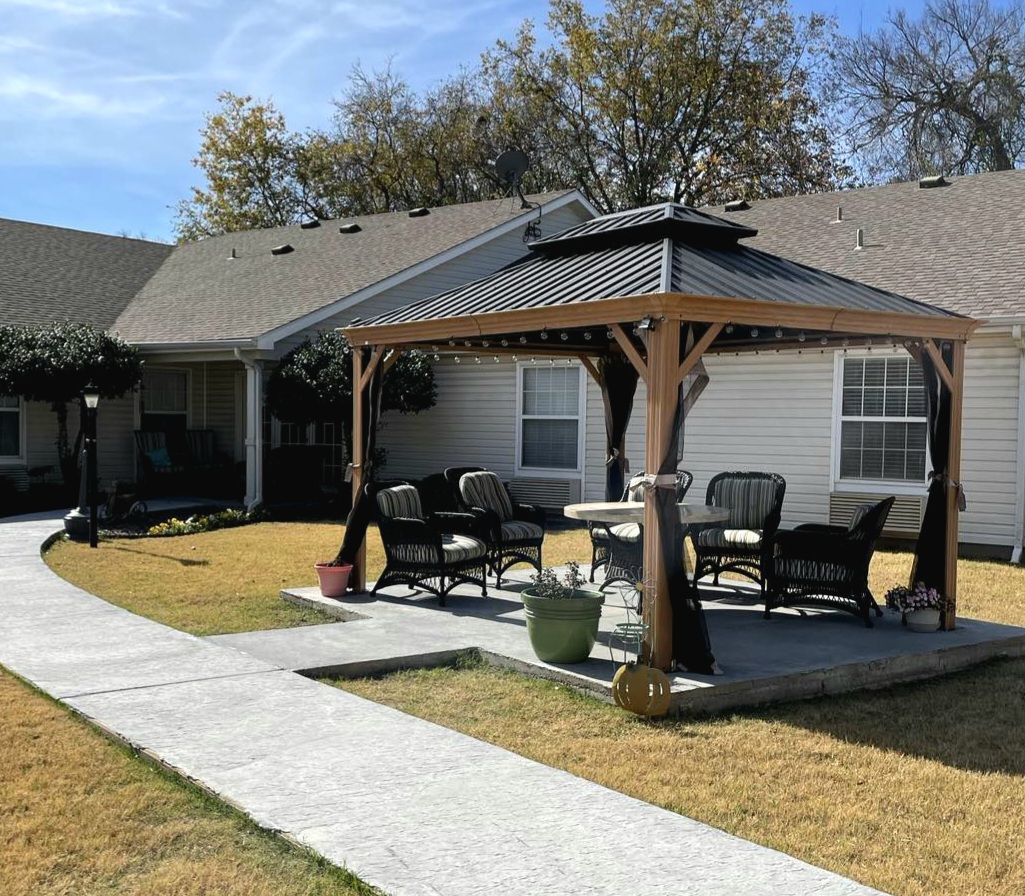 Outdoor gazebo with seating area in a garden