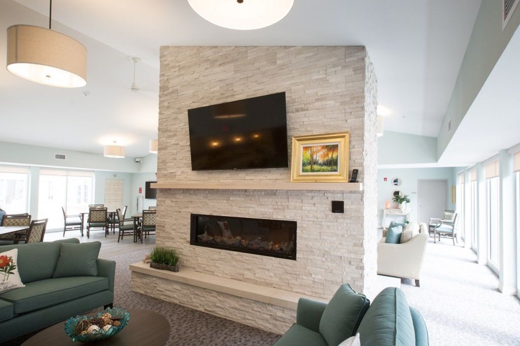 Cozy interior lounge with modern design and fireplace.