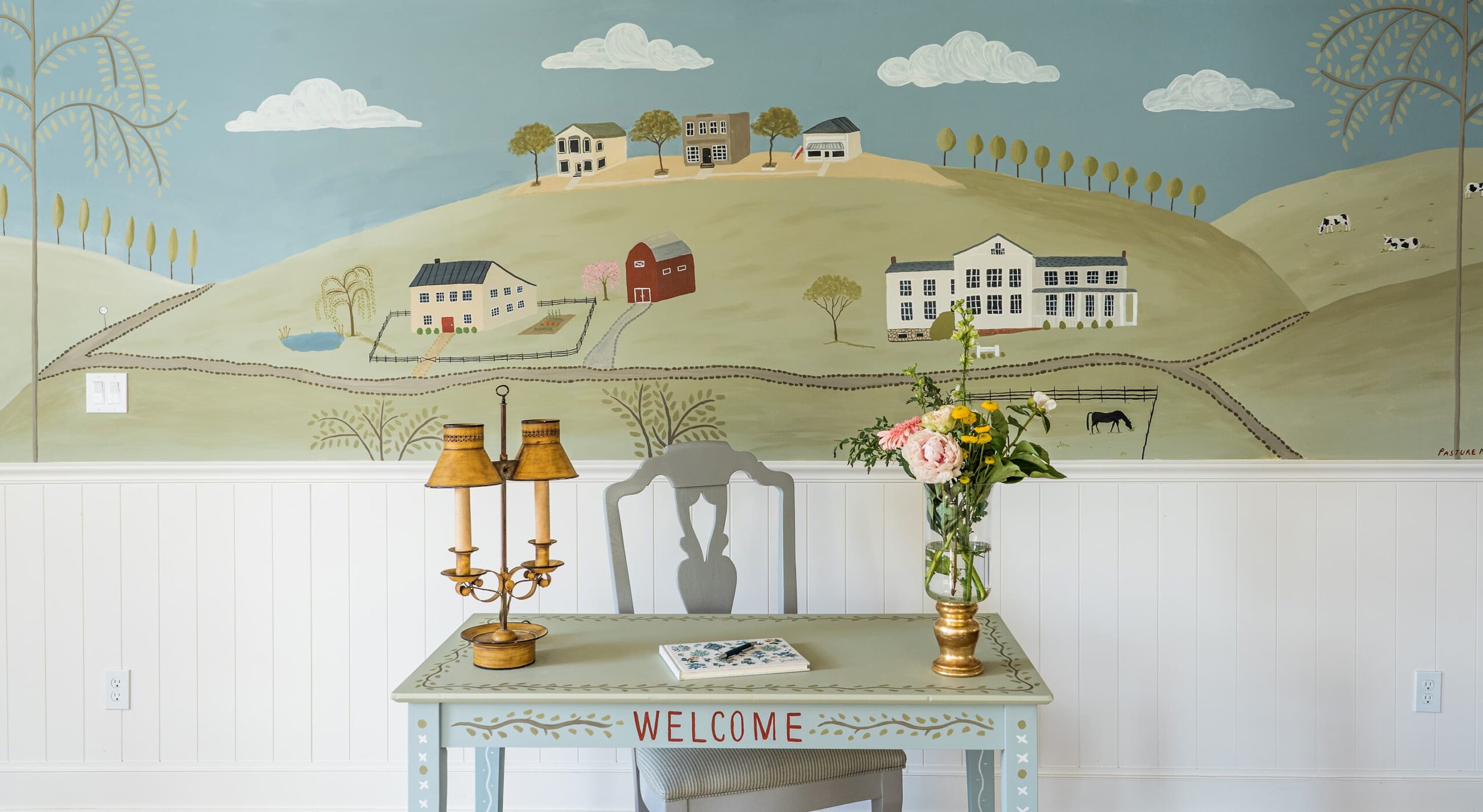 Welcoming lobby area with decorative painting.