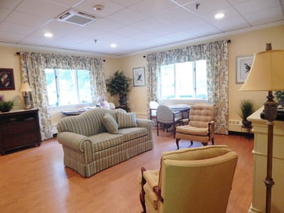 Comfortable common area with furniture and residents.