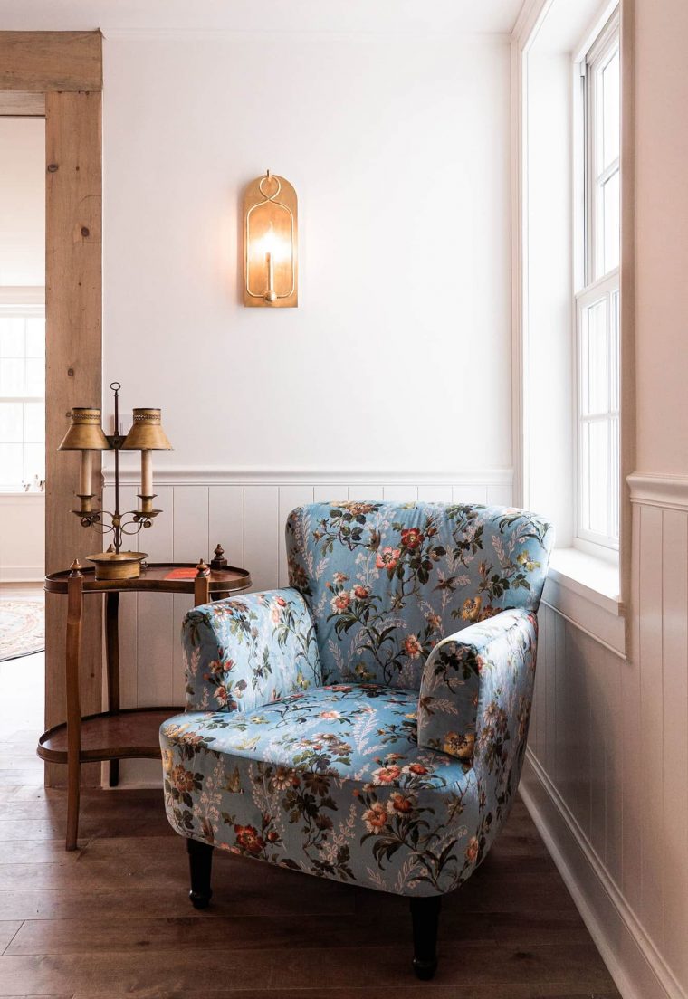 Cozy floral armchair in a light interior space.