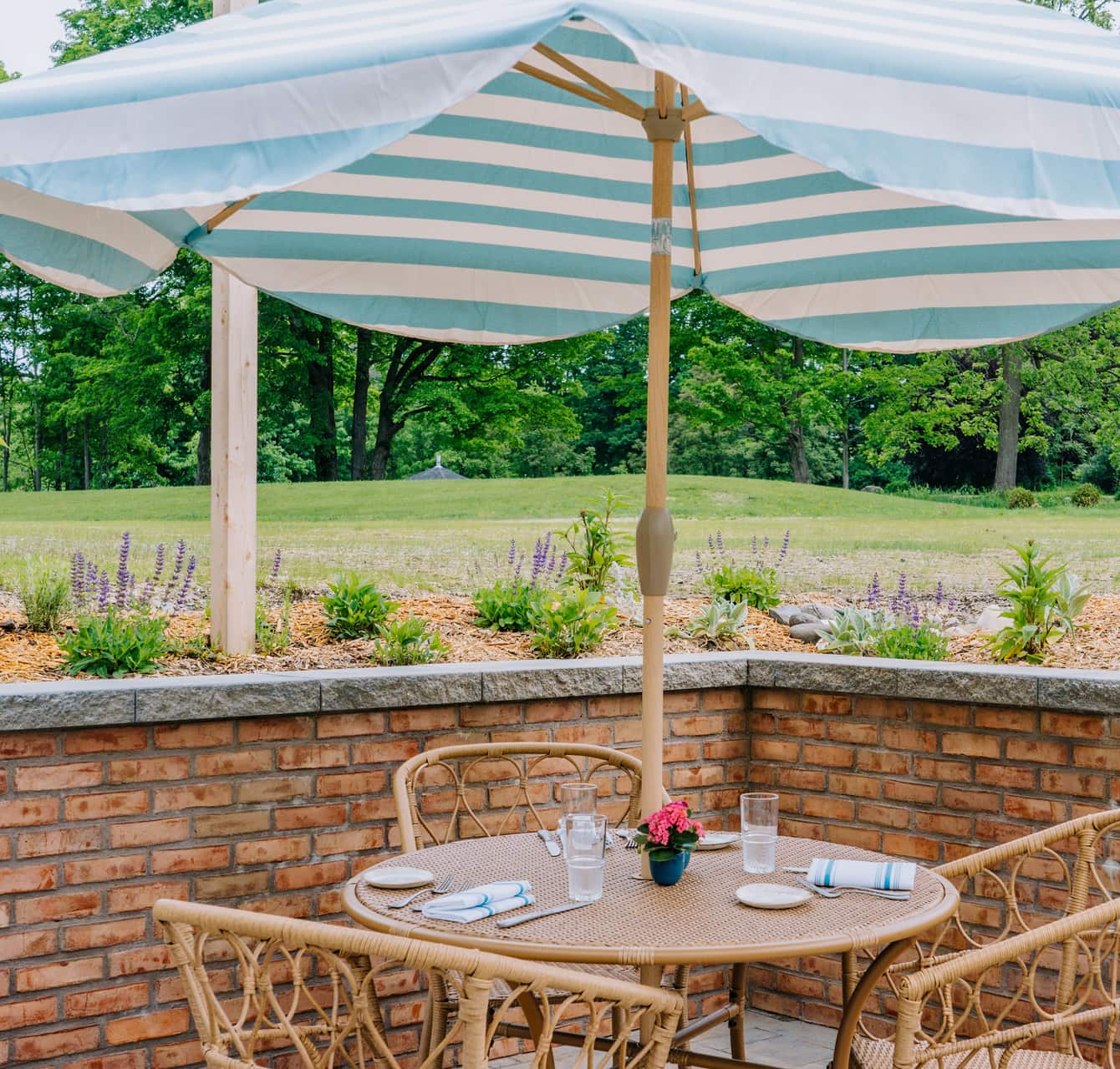 Outdoor dining area with striped umbrella