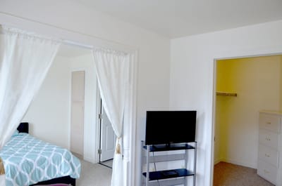 Cozy resident room with a TV and closet