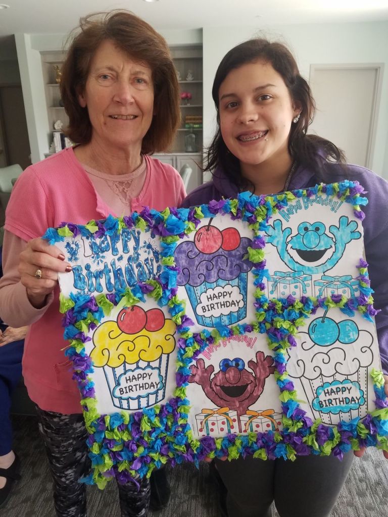 Residents celebrating a birthday with crafts.