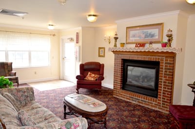 Cozy common area with seating and fireplace.