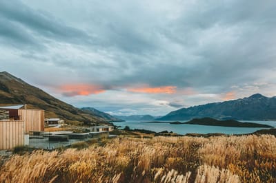 Scenic view with mountains and lakes at sunset.