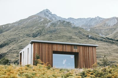 Modern building exterior with mountain background