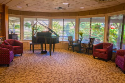 Cozy common area with a piano and seating