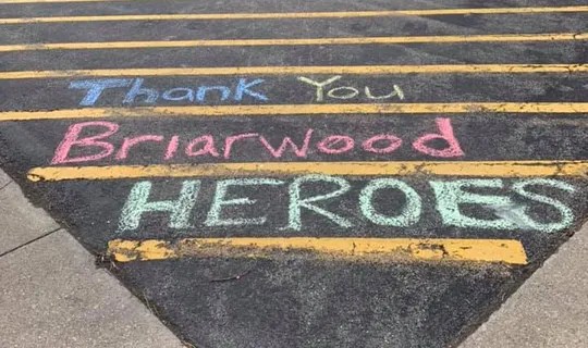 Chalk thank-you message on pavement