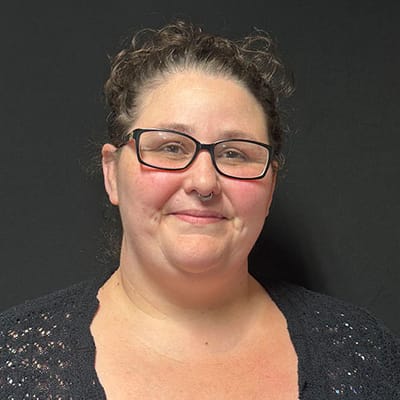 Female staff member smiling at the camera
