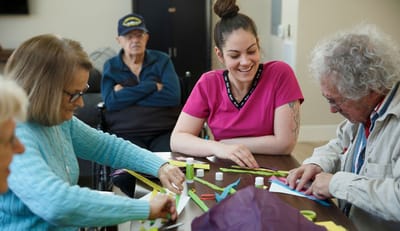 Residents and staff engaging in a creative activity.