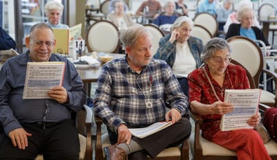 Residents engaged in a group activity in a common area.