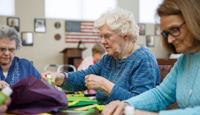 Residents participating in a craft activity.