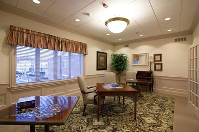 Cozy common area with seating and a puzzle table.