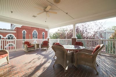 Covered outdoor seating area with comfortable chairs