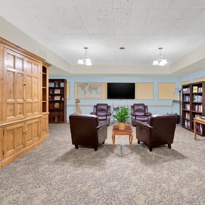Common area with seating and bookshelves