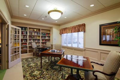 Cozy common area with bookshelves and seating