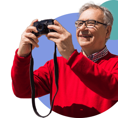 Senior man taking photos outdoors
