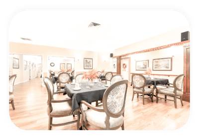 Dining area with tables and chairs set for a meal