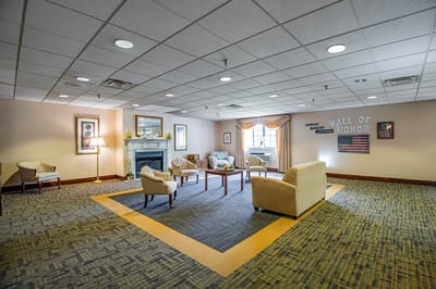 Common area with seating and decorative wall