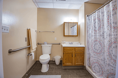 Clean bathroom with shower and sink