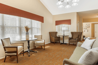 Cozy common area with seating and natural light.