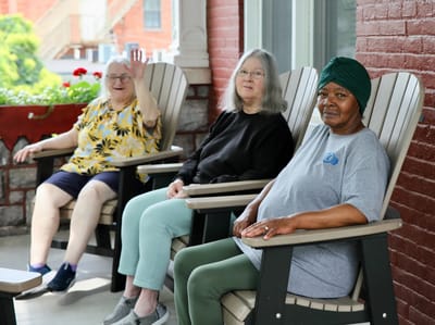 Residents enjoying time on the porch together.