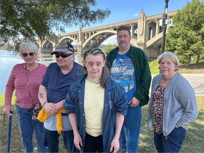 Group of residents enjoying a day outdoors by the water.