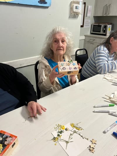 Senior resident participating in a crafting activity.