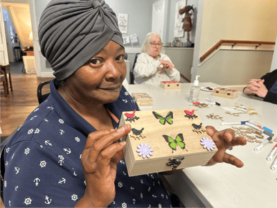 Resident engaged in a craft activity.