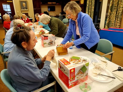 Residents engaging in a gingerbread house activity