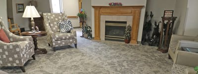 Cozy common area with seating and a fireplace