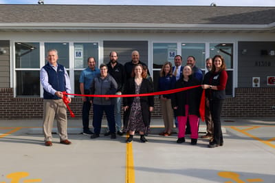 Ribbon-cutting ceremony for facility opening.