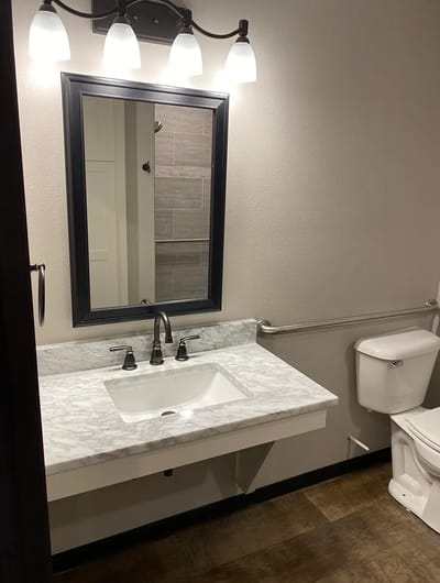 Modern bathroom with a sink and mirror.
