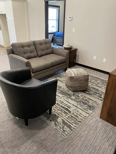 Cozy lounge area with seating and decor.