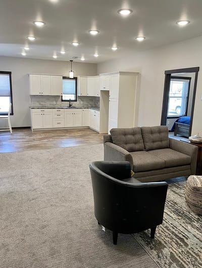 Spacious common area with a modern kitchen setup
