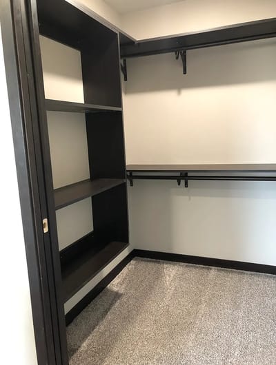 Empty closet space with shelves