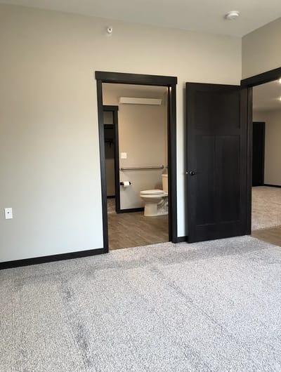 Interior view of a resident room with bathroom