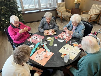 Residents engaged in an arts and crafts activity.